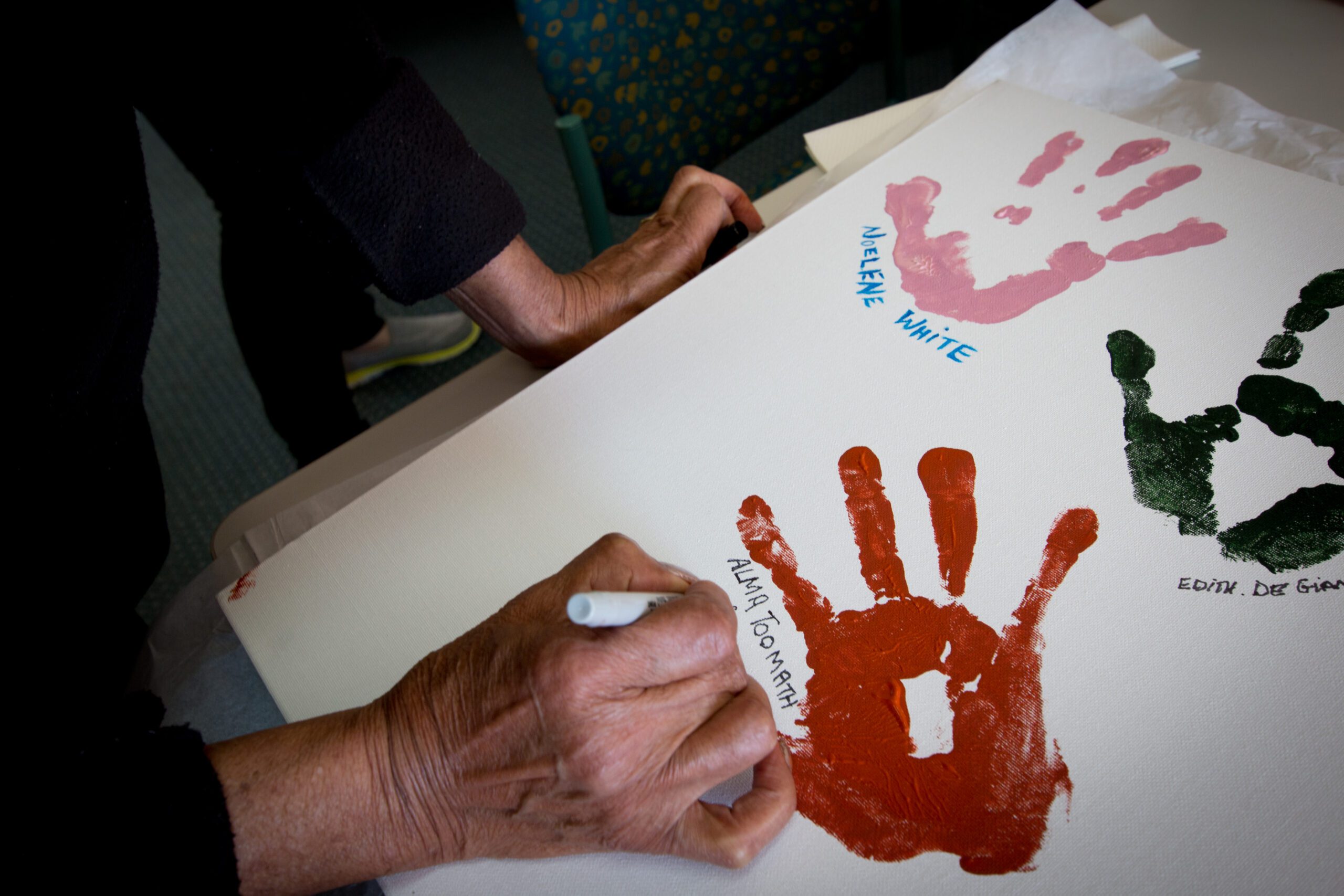 Alma-signing-hands